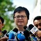 Human rights lawyer Anon Numpa speaks to the media as he arrives at the Criminal Court to answer charges of violating his bail terms in Bangkok