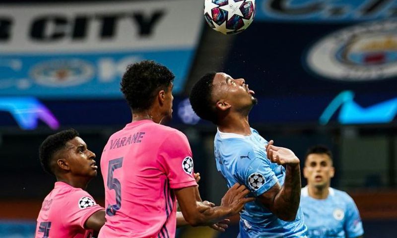 Gabriel Jesus made the most of two shocking mistakes by Raphael Varane, scoring one goal and creating another as Manchester City beat Real Madrid 2-1 to reach the Champions League quarter-finals 4-2 on aggregate on Friday