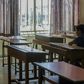 A Lebanese pupil looks out of the window of his empty classroom at Our Lady of Lourdes school, a century-old establishment in the city of Zahle that is due to close because of Lebanon's worst economic crisis sine the 1975-1990 civil war