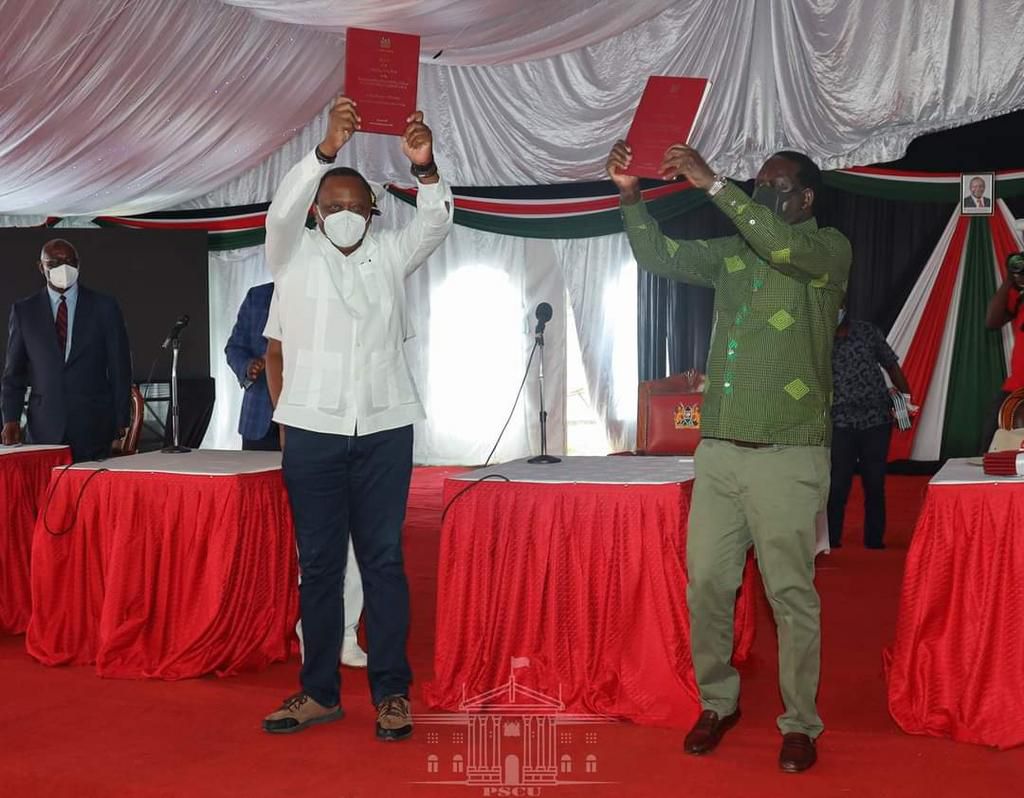 President Uhuru Kenyatta and Opposition Leader Raila Odinga receiving the final BBI Report