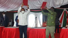 President Uhuru Kenyatta and Opposition Leader Raila Odinga receiving the final BBI Report