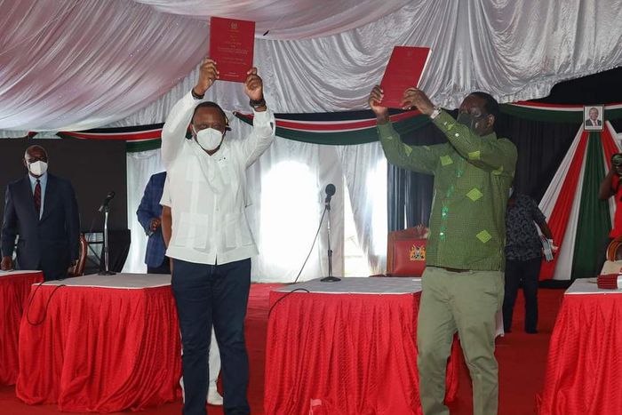 President Uhuru Kenyatta and Opposition Leader Raila Odinga receiving the final BBI Report