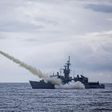 A warship launches a US-made Harpoon missile during the annual drill