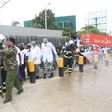 KDF soldiers with disinfection and crowd control at the Likoni Channel crossing
