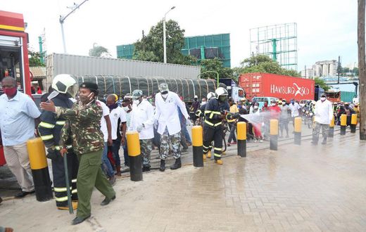 KDF soldiers with disinfection and crowd control at the Likoni Channel crossing