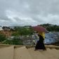 A Rohingya woman climbs a hill as she goes back to her makeshift home in Jamtoli refugee camp, near Ukhia in Bangladesh