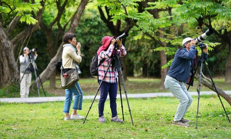 Taiwan bird watchers taking photos at the Da'An Forest Park in Taipei. A Taiwan bird protection group has been ejected from a global body because it refused to sign a statement saying it would never advocate for the island's independence
