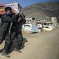 Cemetery workers carry the coffin of a COVID-19 victim at a graveyard in Comas, in the northern outskirts of Lima.