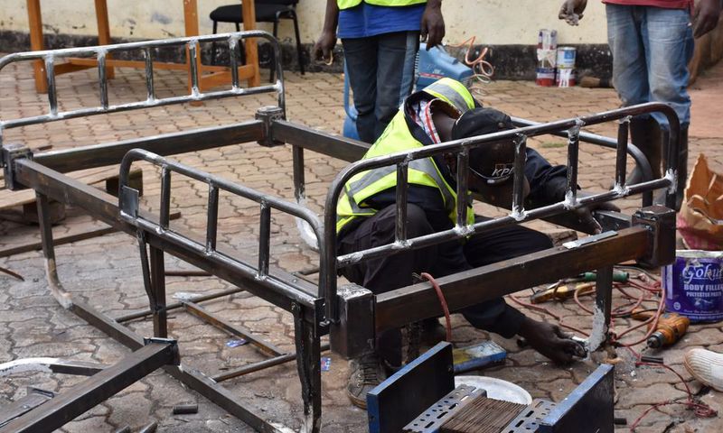 Welders in Githunguri work on local ICU bed innovation by Mungai Gathogo and Joseph Muhinja