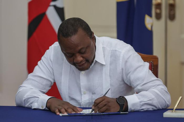 President Uhuru Kenyatta signing the IEBC (Amendment) Bill No. 3 at State House, Nairobi
