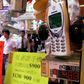 People walk past a mobile phone shop displaying lucky telephone numbers for sale in Hong Kong. Many Asian cultures consider certain numbers -- such as eight -- as good fortune