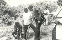 1991: Justice Evans Gicheru, Chairman of the Ouko Murder Commission of Inquiry, examines the spot on the foot of Got Alila hill in Kisumu where remains of former Foreign Affairs Minister Robert Ouko were found
