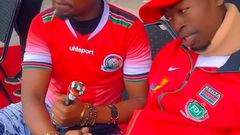 File image of the late Ezekiel Otuoma with former Sports CS Ababu Namwamba