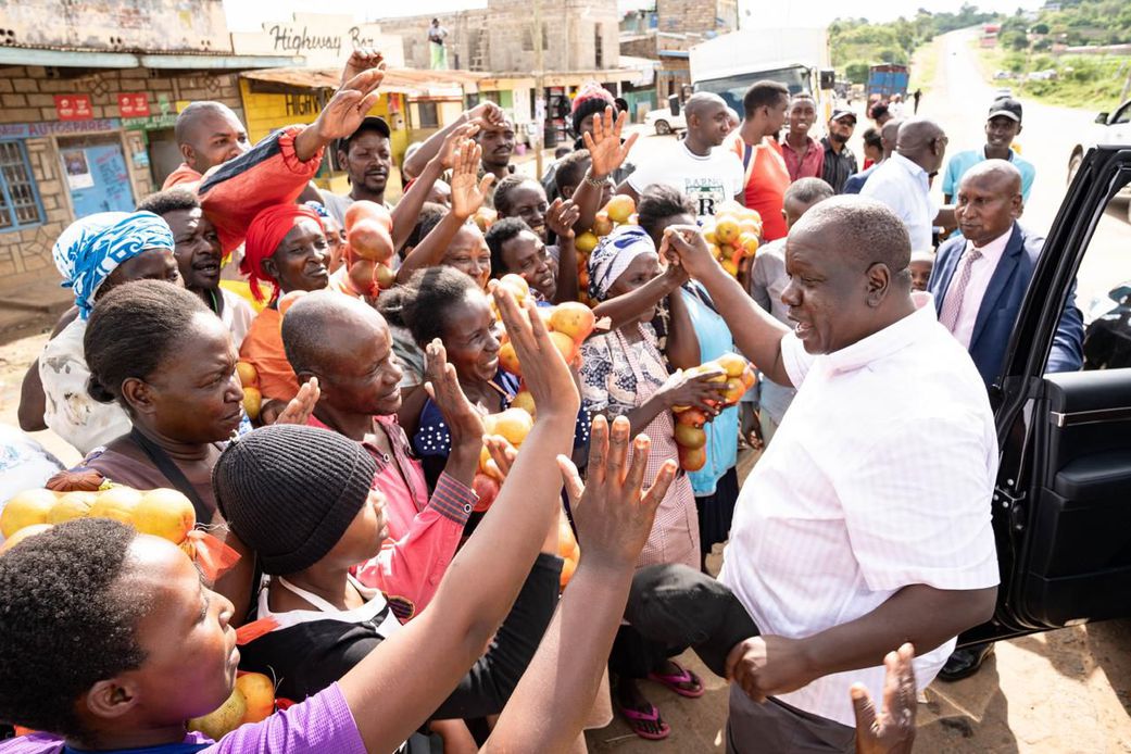Former Interior CS Fred Matiang'i interacting with traders and purchasing local commodities in Kitui on December 20, 2024.