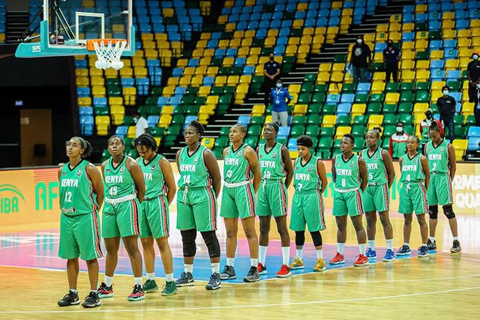 Team Lionesses sing the Kenya national anthem during the FIBA Women's AfroBasket 2021 Zone 5 qualifiers match between hosts Rwanda and Kenya at Kigali Arena in Kigali, Rwanda on July 16, 2021.
