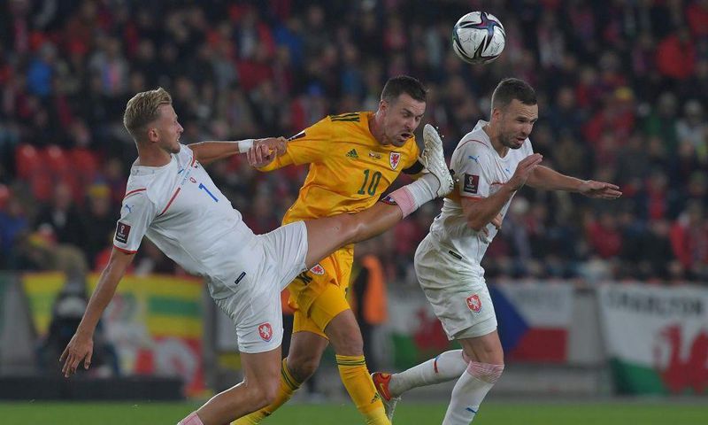 Man in the middle: Czech Republic's Antonin Barak (left) and Filip Novak (right) challenge Wales midfielder Aaron Ramsey