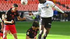 Valencia's French defender Mouctar Diakhaby (right) seen here playing against Real Sociedad walked off the pitch in the game against Cadiz