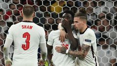 England's Bukayo Saka (C) was among those receiving racial abuse online