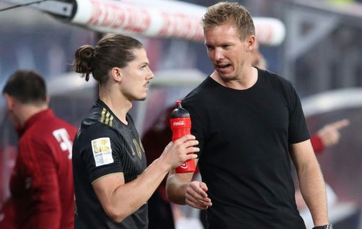 Bayern Munich head coah Julian Nagelsmann (R) speaks to Marcel Sabitzer, who made his club debut at Leipzig on Saturday