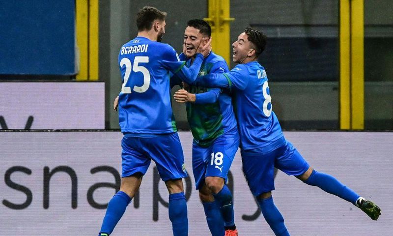 Domenico Berardi (L) scored to keep Sassuolo in the chase for the Europa League.