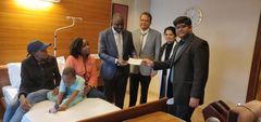 Ethan Macharia, his mother Veronica Njeri ( in pink) with officials from the Kenyan Embassy in India and his doctors at the Forties hospital on Friday, February 29, 2020 after President Uhuru Kenyatta intervened