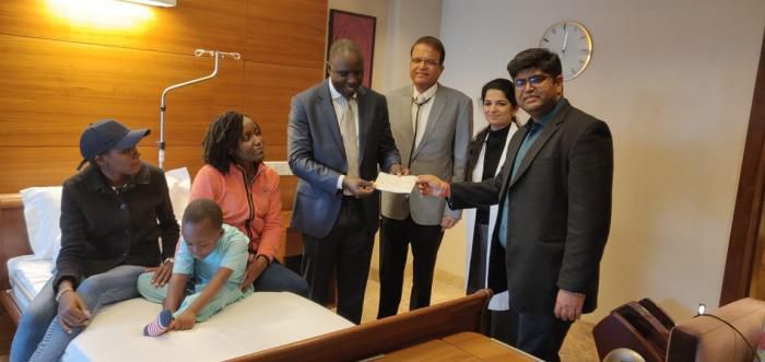 Ethan Macharia, his mother Veronica Njeri ( in pink) with officials from the Kenyan Embassy in India and his doctors at the Forties hospital on Friday, February 29, 2020 after President Uhuru Kenyatta intervened