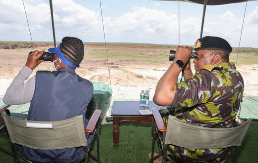 President Uhuru Kenyatta watching Kenyan security officers undertaking a joint operational training in Boni Forest, Lamu County.