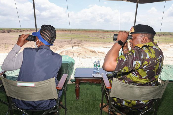 President Uhuru Kenyatta watching Kenyan security officers undertaking a joint operational training in Boni Forest, Lamu County.