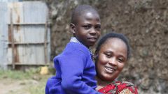 Jacqueline Khalenya embraces her son Rhonick Omondi