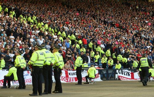Lines of police separate rival England and Scotland supporters