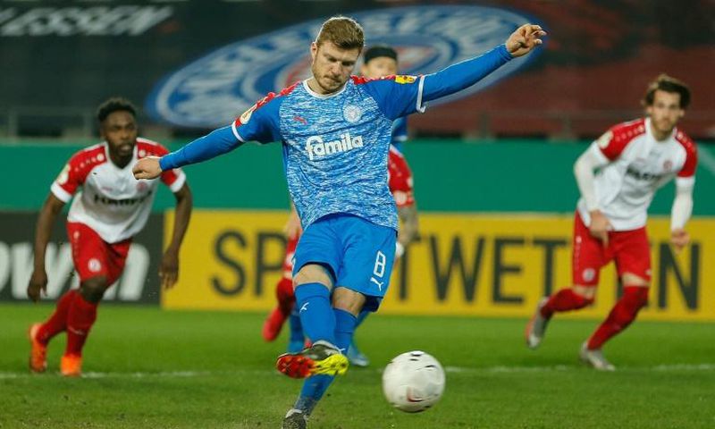 Holstein Kiel midfielder Alexander Muehling nets their first-half penalty at Kiel