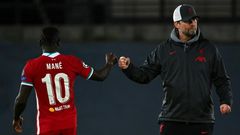 Jurgen Klopp (right)has to inspire a Liverpool fightback against Real Madird in front of an empty Anfield