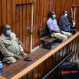 Kenyan police officers, Naftali Chege (L), Charles Munyiri Wagombe (2nd-L), Ismael Baraka Bulima (2nd-R) and John Pamba (R), sit in the dock at the Mombasa Law Court in Mombasa, on November 15, 2021. (Photo by DIHOFF MUKOTO/AFP via Getty Images)