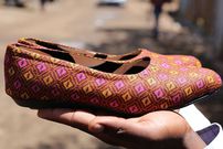 A pair of flat shoes made by Kenyan brand Re Afric