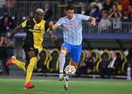 Cristiano Ronaldo battles with Mohamed Ali Camara during Manchester United's defeat against Young Boys