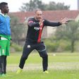 Former Kenyan national football team's French head coach Sebastien Migne (C) speaks to players during a training session at Kasarani Stadium in Nairobi, Kenya, on May 20, 2019. - (Photo by Yasuyoshi CHIBA / AFP) (Photo credit should read YASUYOSHI CHIB...