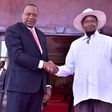 FILE PHOTO: Kenyan President Uhuru Kenyatta (L) shakes hands with Ugandan President Yoweri Museveni. (STR/AFP/Getty Images)