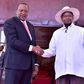 FILE PHOTO: Kenyan President Uhuru Kenyatta (L) shakes hands with Ugandan President Yoweri Museveni. (STR/AFP/Getty Images)