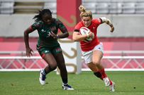 Britain's Megan Jones (R) is chased by Kenya's Diana Ochieng during the women's pool A rugby sevens match between Britain and Kenya during the Tokyo 2020 Olympic Games at the Tokyo Stadium in Tokyo on July 30, 2021. (Photo by GREG BAKER / AFP) (Photo by GREG BAKER/AFP via Getty Images)