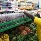 A supermarket attendant arranges fruits at a supermarket, as residents stock their homes amid concerns about the spread of the COVID-19 coronavirus, in Nairobi, Kenya, on March 30, 2020. (Photo by SIMON MAINA/AFP via Getty Images)