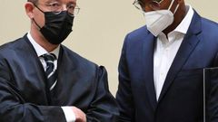 Former Bayern Munich defender Jerome Boateng (R) and his lawyer Kai Walden in court in Munich