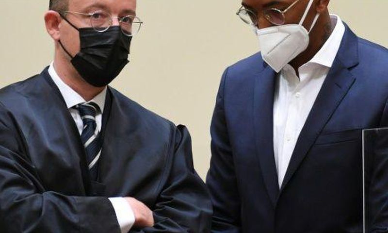 Former Bayern Munich defender Jerome Boateng (R) and his lawyer Kai Walden in court in Munich
