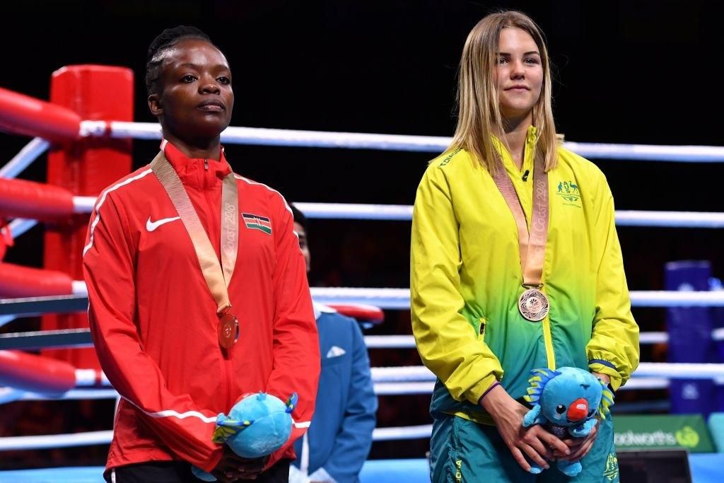 Bronze medallists Kenya's Christine Ongare (L) and Australia's Taylah Robertson pose with their medals during the medal ceremony for the women's 51kg boxing event during the 2018 Gold Coast Commonwealth Games at the Oxenford Studios venue on the Gold C...