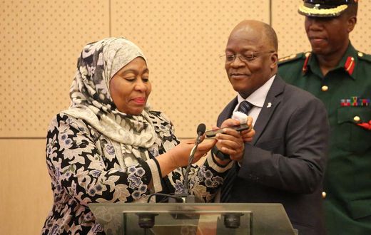 Tanzania's Vice President Samia Hassan Suluhu and President John Magufuli taking a call together in July 2019.
