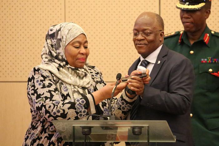 Tanzania's Vice President Samia Hassan Suluhu and President John Magufuli taking a call together in July 2019.