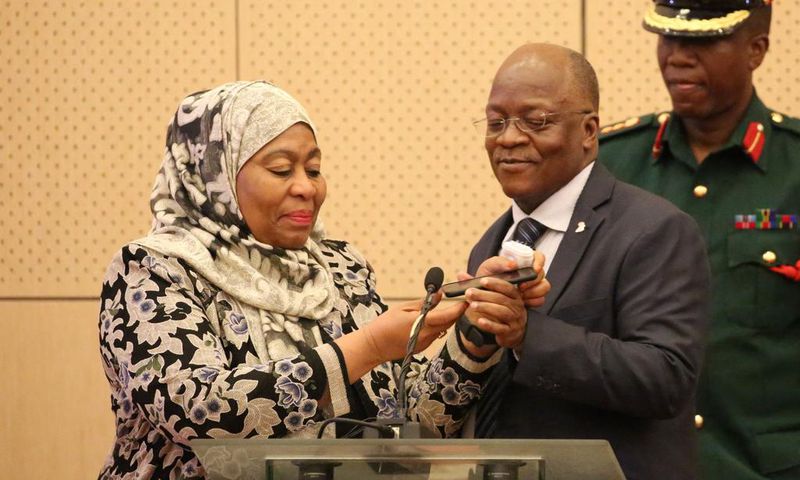 Tanzania's Vice President Samia Hassan Suluhu and President John Magufuli taking a call together in July 2019.