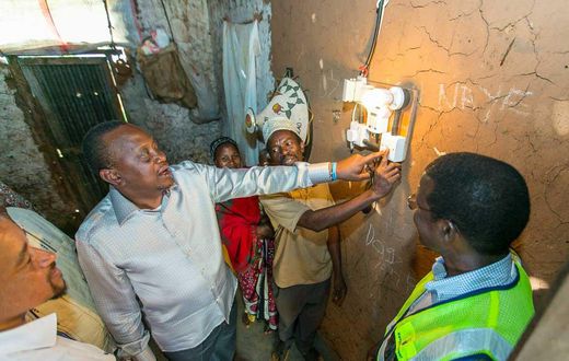 President Uhuru Kenyatta launching electricity at a Kenyan home