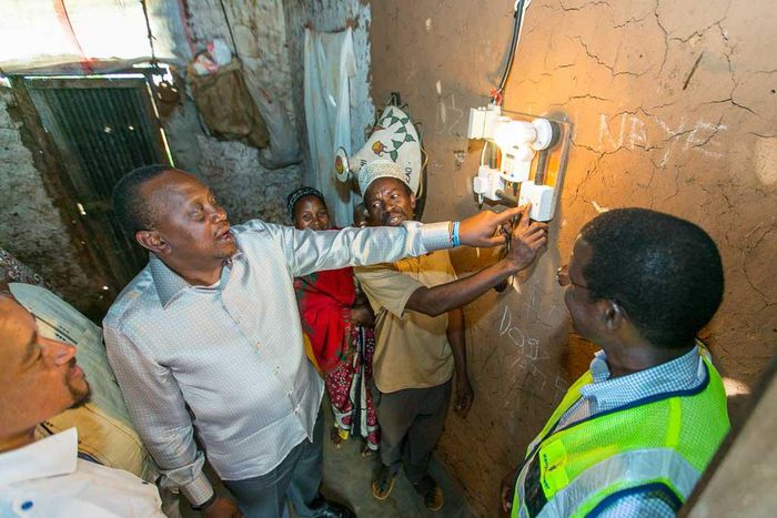 President Uhuru Kenyatta launching electricity at a Kenyan home