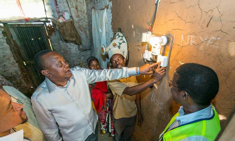 President Uhuru Kenyatta launching electricity at a Kenyan home