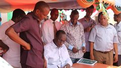 File image of former Tana River Governor Hussein Dado signing documents